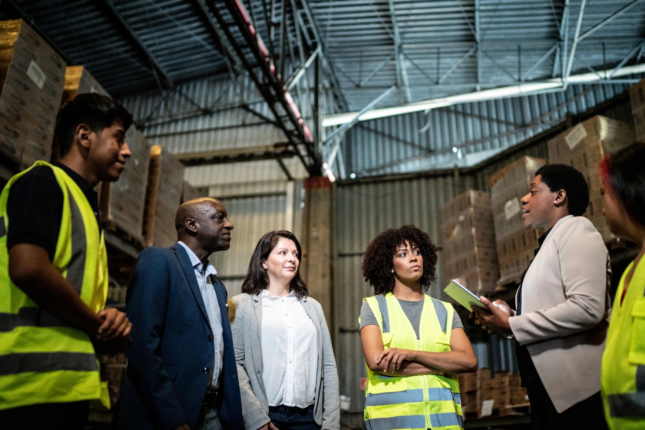 ASM Blankets team collaborating in a warehouse setting